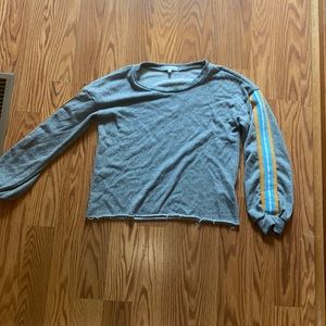 Grey long sleeve shirt with yellow and blue striped on both arms